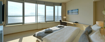 Interior view of a Suite in the ATLANTIC Hotel SAIL City in Bremerhaven with an amazing view over the Weser