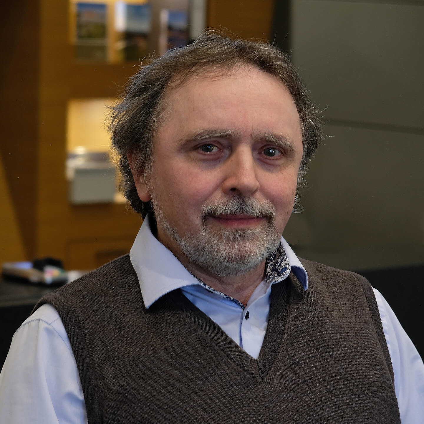 Hotel Technology Alexander Peksa  A gentleman in a shirt with slightly gray hair and beard