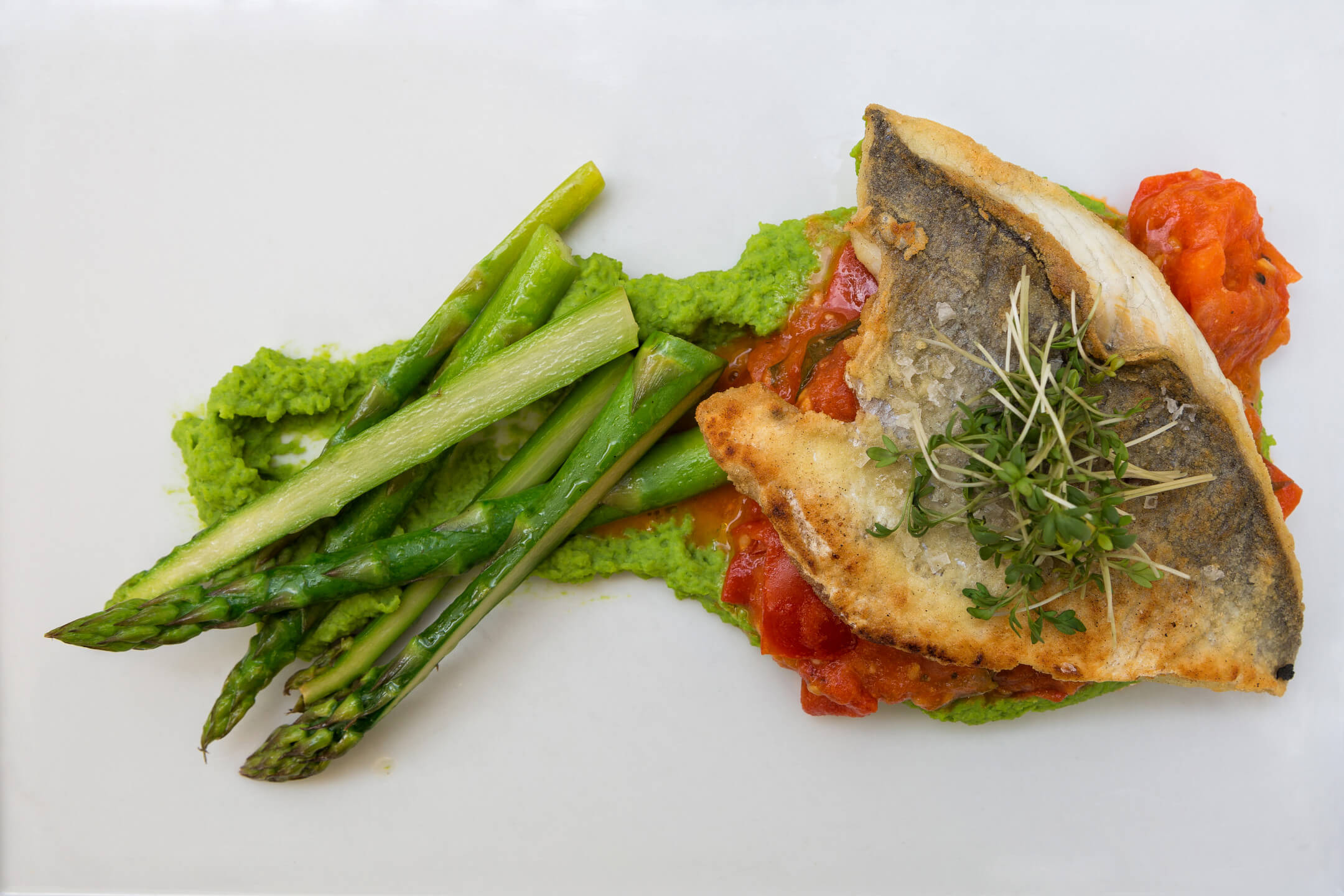 served plate with asparagus and fish