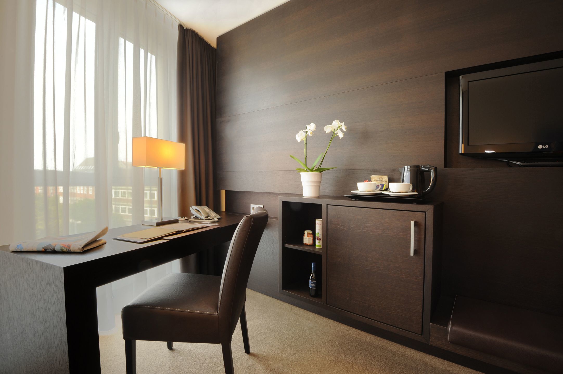 Desk and TV in the superior room of the ATLANTIC Grand Hotel in the city centre of Bremen