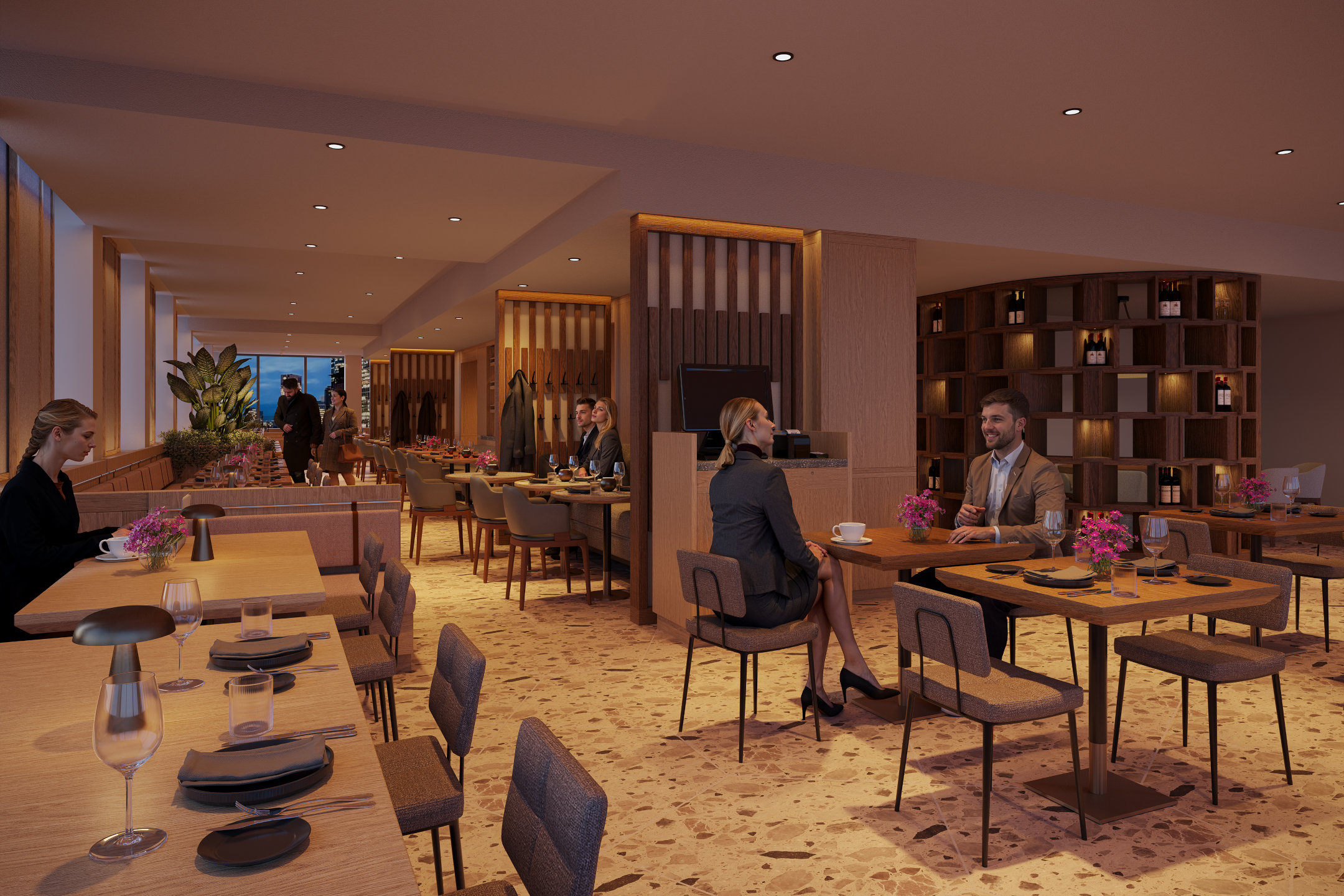 Das moderne Restaurant im ATLANTIC Hotel Frankfurt mit verschiedenen Tischgruppen, warmen Licht und hölzernen Trennwänden.