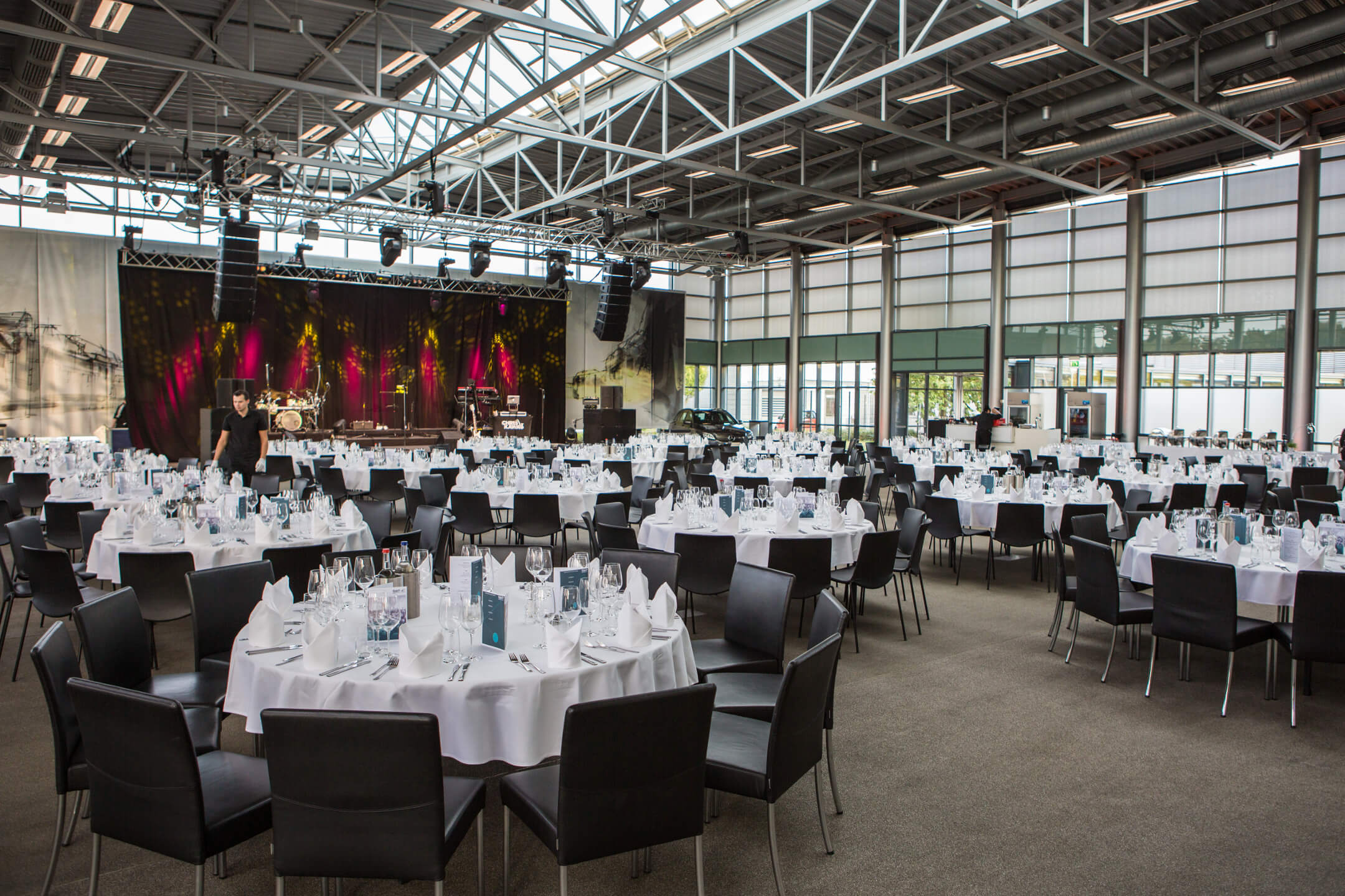 The Übergabehalle of the Mercedes-Benz customercenter with festive covered table