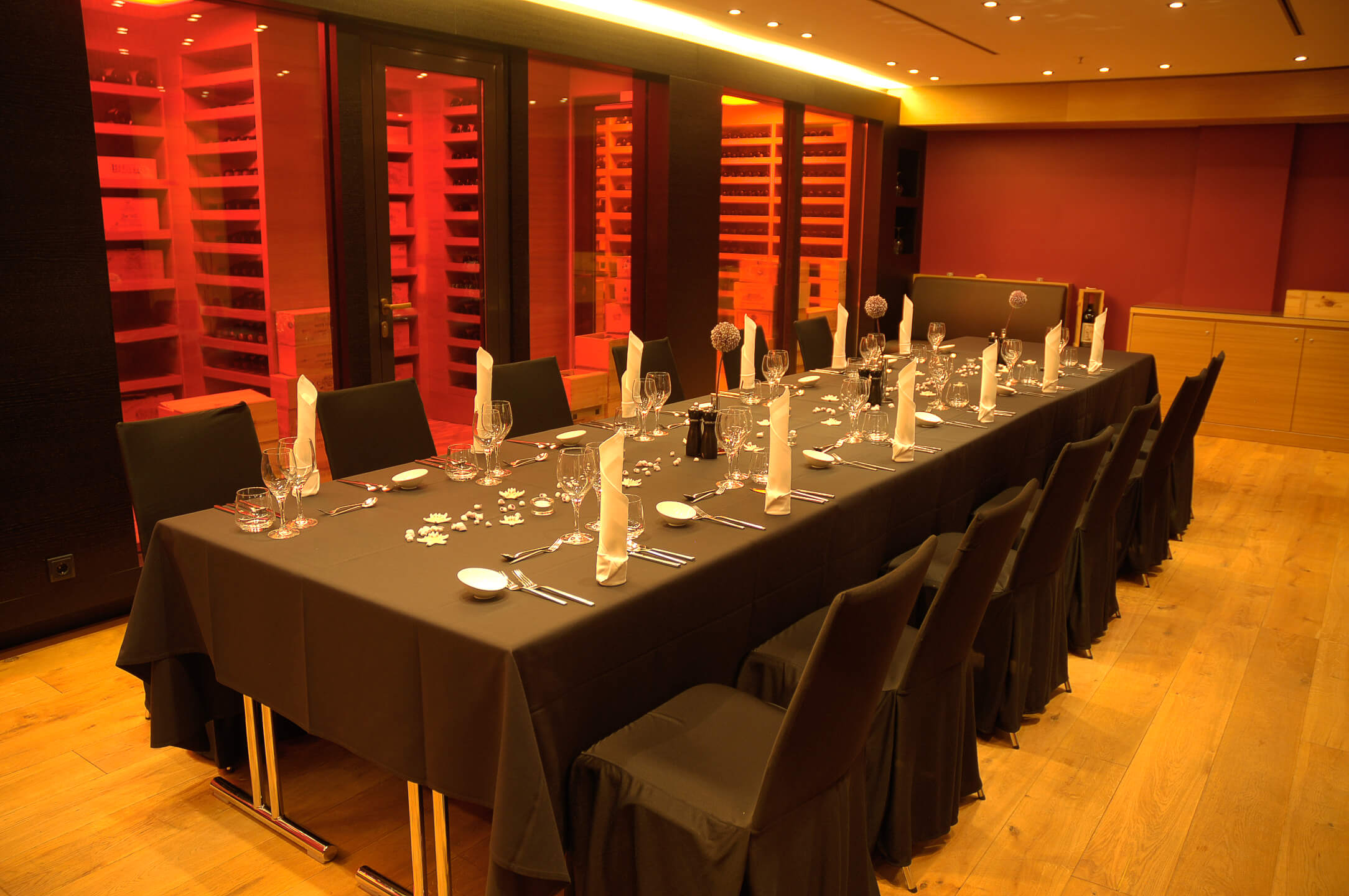 Festive table in black in the wine cellar of the ATLANTIC Hotel Kiel