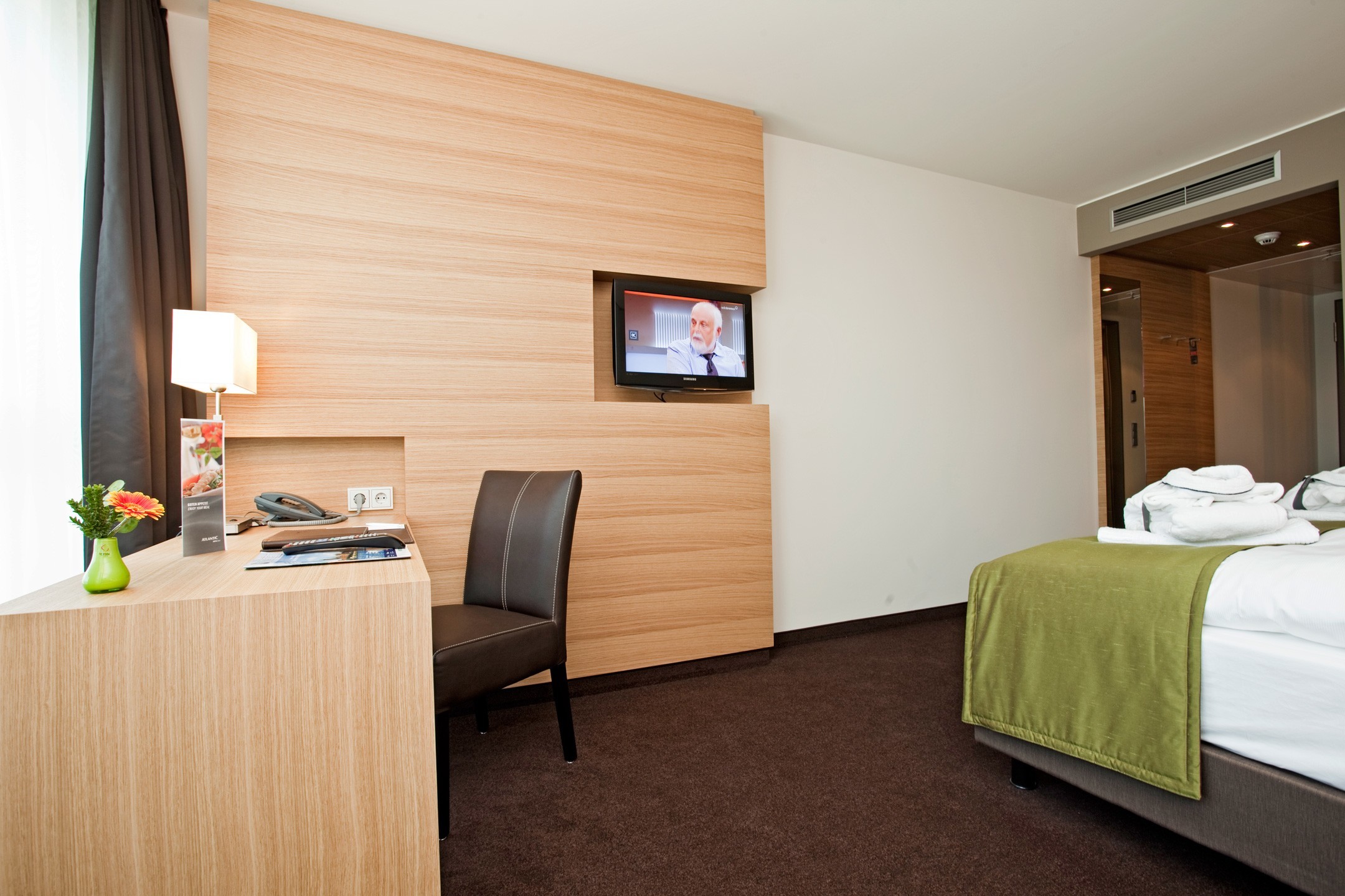 Interior view of the Comfort Room with a double bed in the ATLANTIC Hotel Kiel