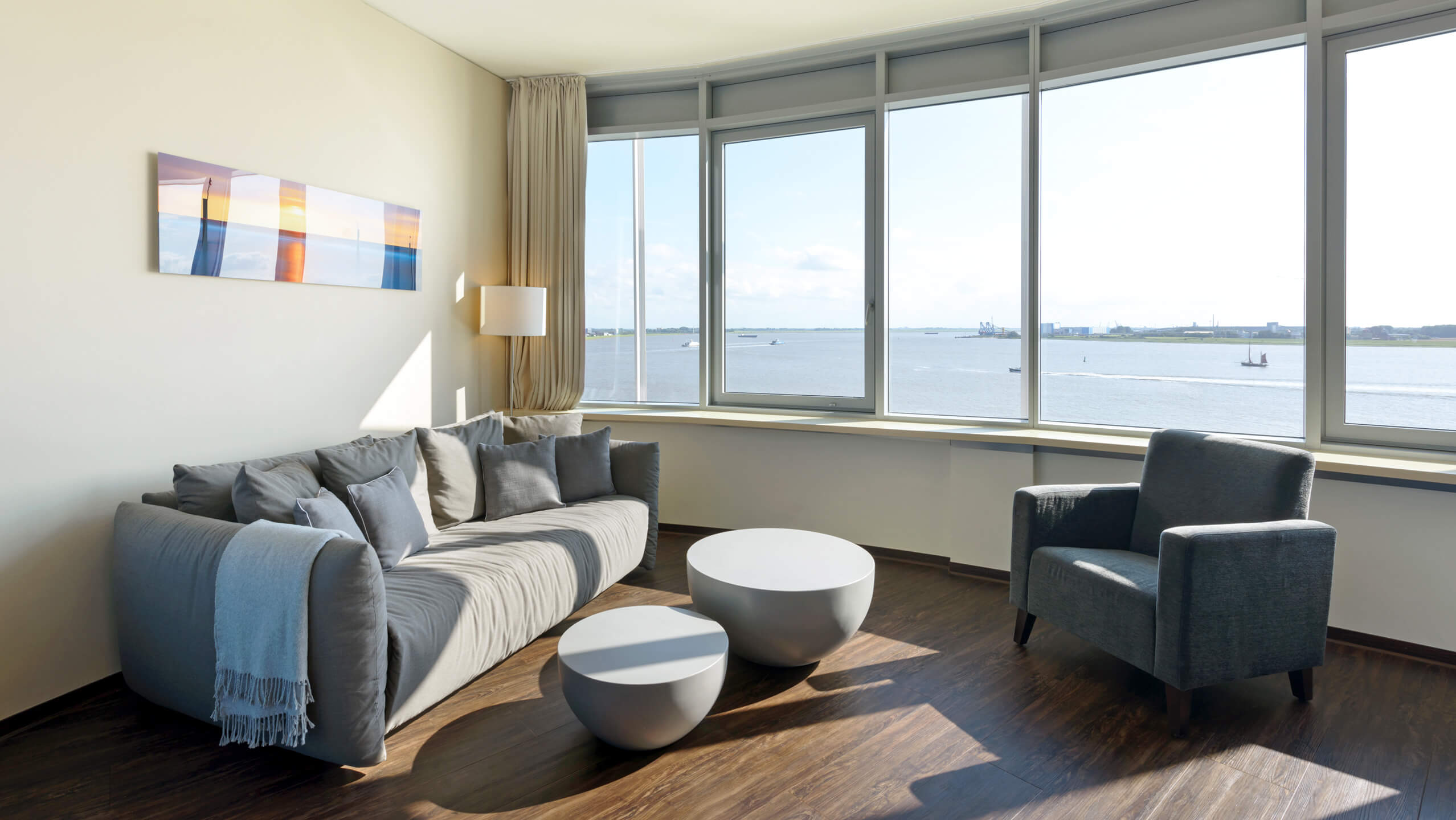 Interior view of the Suite in the ATLANTIC Hotel SAIL City in Bremerhaven with an amazing view over the Weser