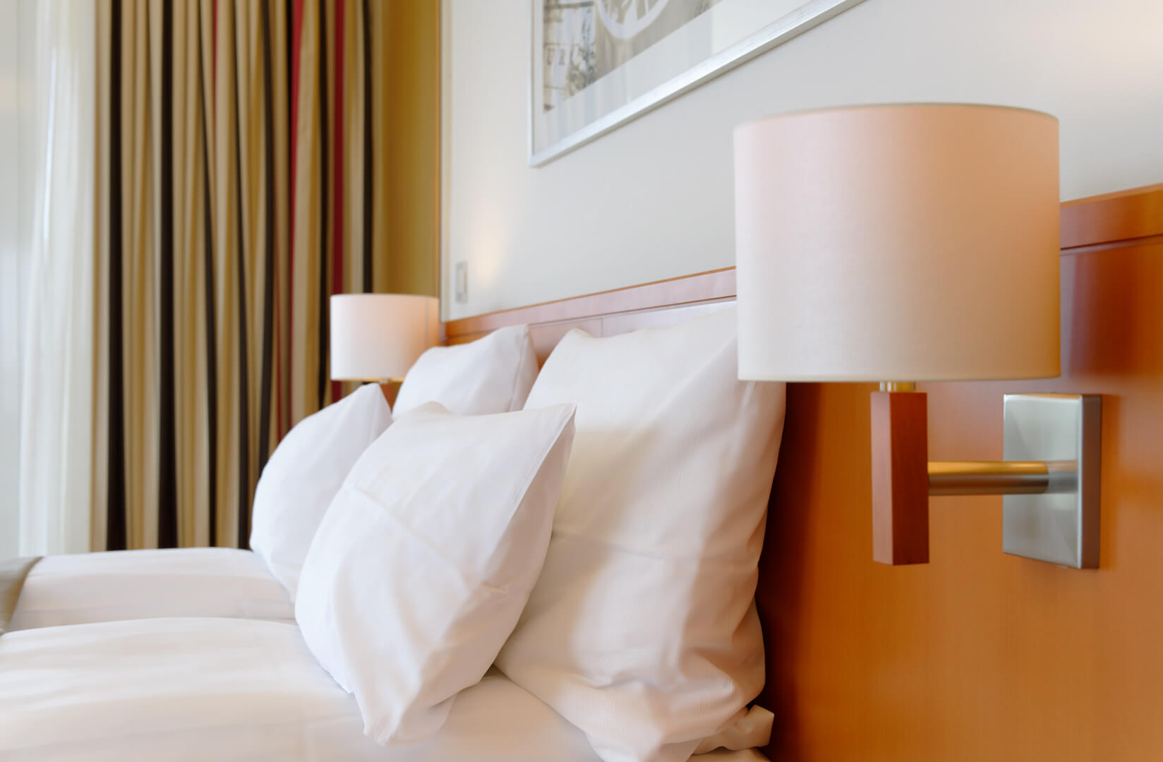 Comfortable bed in a Superior Suite at the ATLANTIC Hotel Wilhelmshaven 