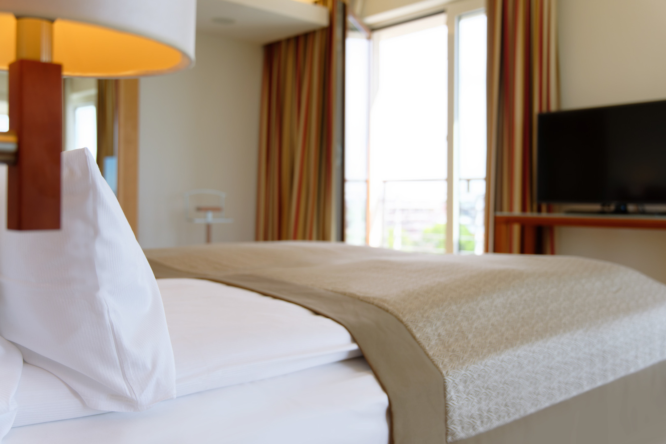 Bett in der Executiven Suite | ATLANTIC Hotel Wilhelmshaven