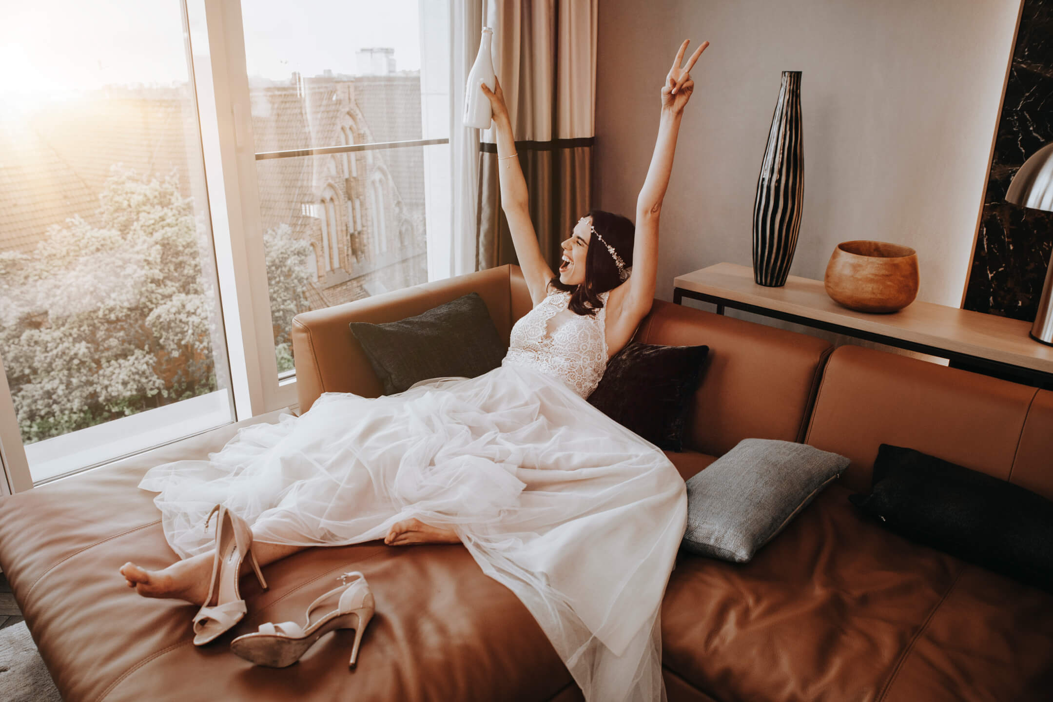 realaxing bride on the sofa of the Grand Suite of the ATLANTIC Grand Hotel Bremen