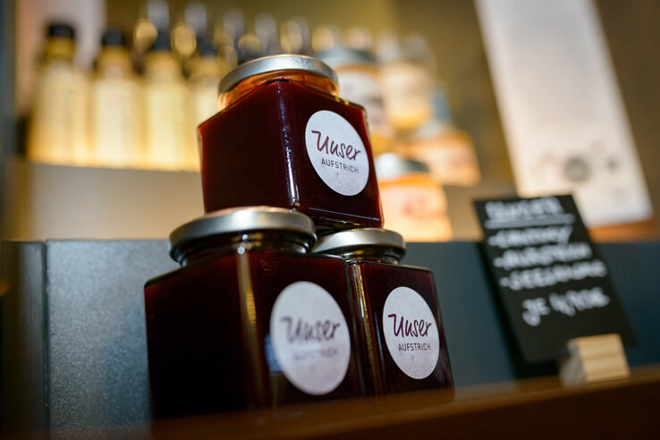 Three jars of red spread, labeled "Our spread", on a shelf in the ATLANTIC Hotel Sail City.