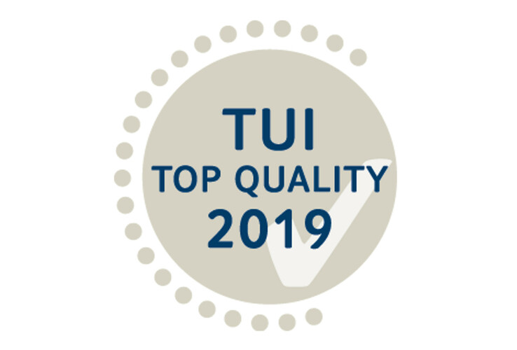 TUI Top Quality 2019 award, beige badge with blue letters and checkmark.
