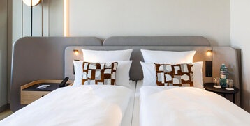 A comfortable double bed in the Skyline room.