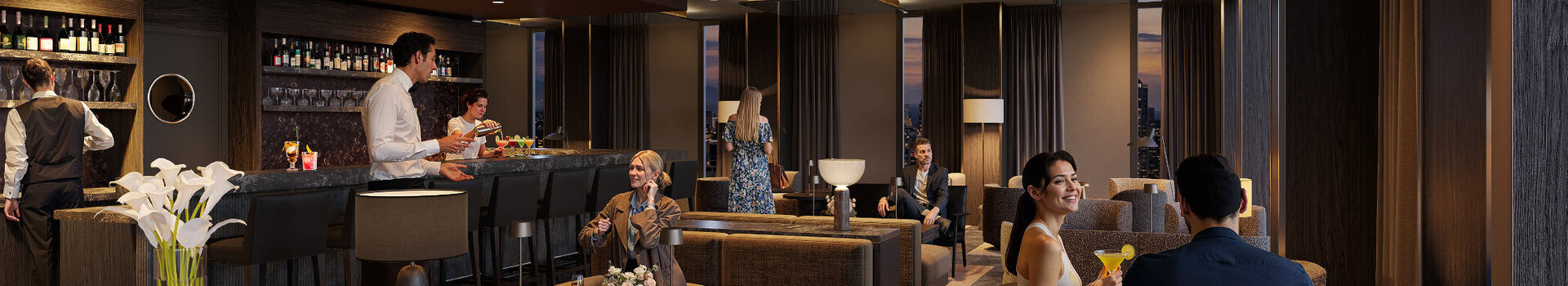Die stimmungsvolle, moderne Bar im ATLANTIC Hotel Frankfurt, mit indirekter Deckenbeleuchtung, dunkelgrauen Wänden, verschiedenen Sesseln als Sitzmöglichkeiten und Dekoration in dunklen Holztönen.