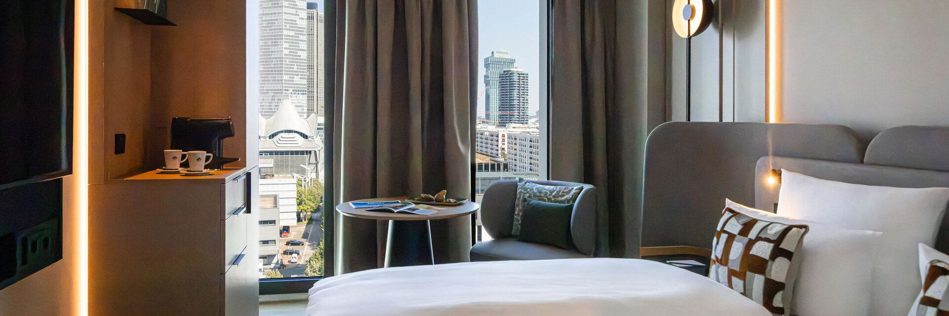 A view of the Frankfurt skyline from the bed in the Skyline Room.