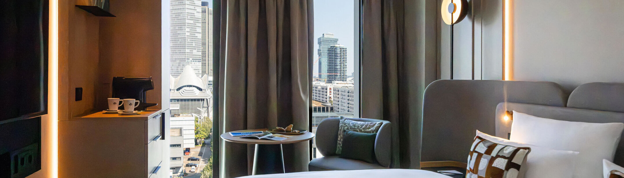 A view of the Frankfurt skyline from the bed in the Skyline Room.
