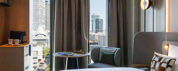 A view of the Frankfurt skyline from the bed in the Skyline Room.