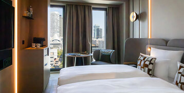 A view of the Frankfurt skyline from the bed in the Skyline Room.