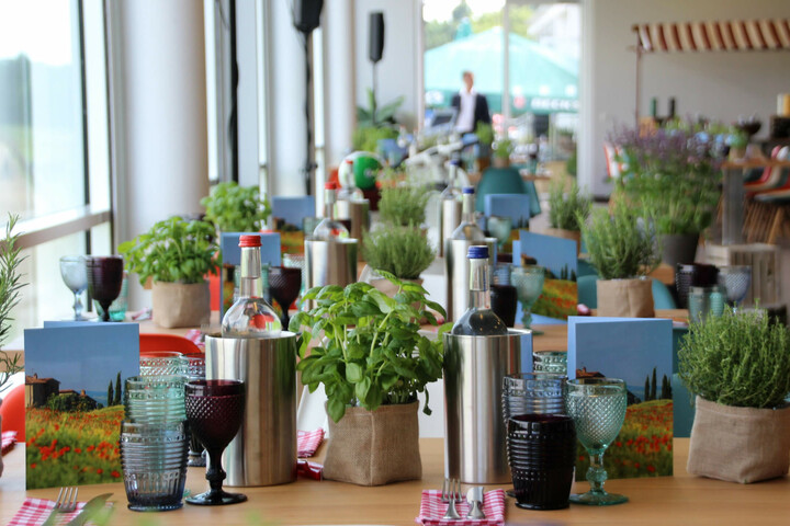 Elegant restaurant in the ATLANTIC Hotel with laid tables, herbs and stylish glasses.