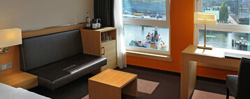 Double bed in Deluxe room overlooking Kiel Fjord in ATLANTIC Hotel Kiel