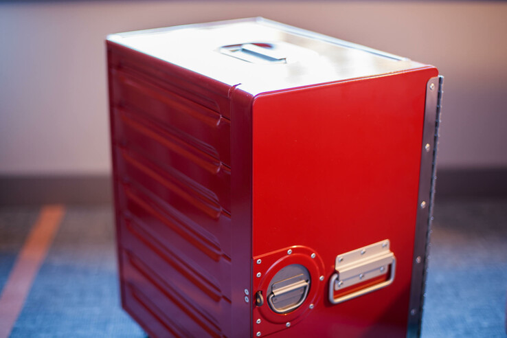 Red airplane trolley on carpeting in the ATLANTIC Hotel Airport Bremen.
