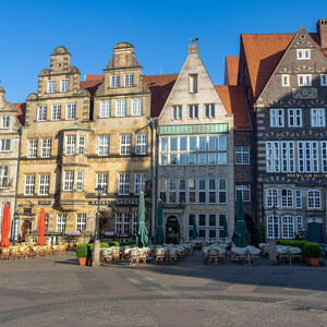 Bremen market place in the old town  Historic facades on Bremen's market square with outdoor catering and parasols on a clear day.