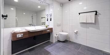 A photograph of the accessible bathroom with an emergency pull cord.
