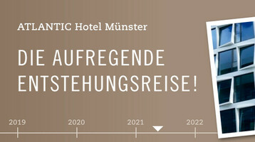 ATLANTIC Hotel Münster im Bau, moderne Glasfassade mit Hebebühne. Text: "Die aufregende Entstehungsreise".