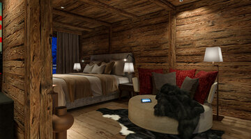 Cozy hotel room with wooden walls, double bed, sofa, red cushions and modern lighting.