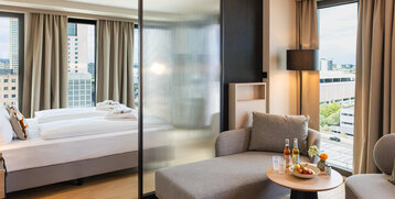 View of the bed and the separate seating area.