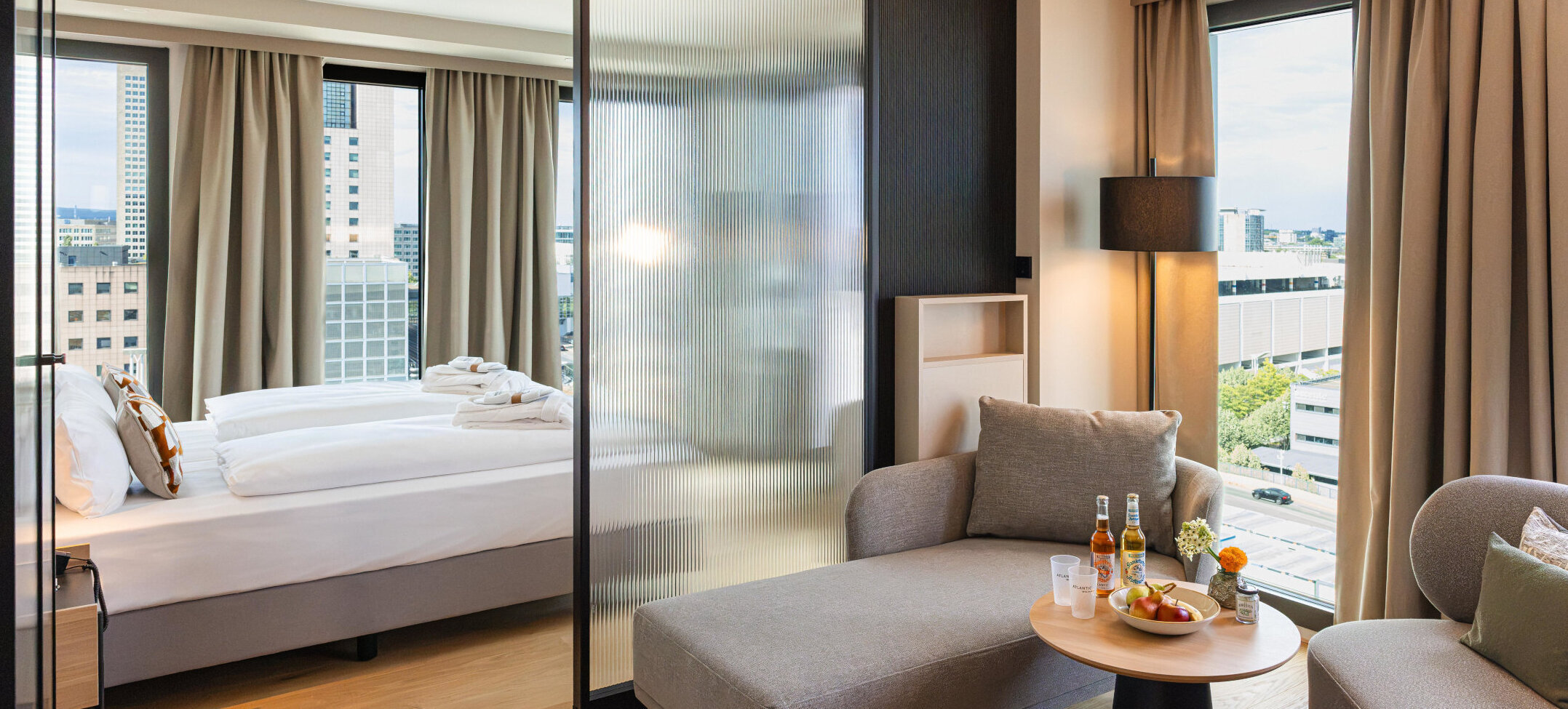 View of the bed and the separate seating area.