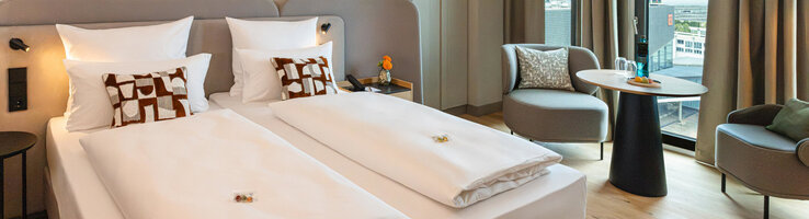 A view of the bed and the seating area in the Superior Double Room.