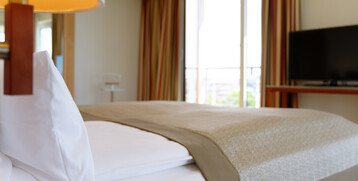 Bett in der Executiven Suite | ATLANTIC Hotel Wilhelmshaven