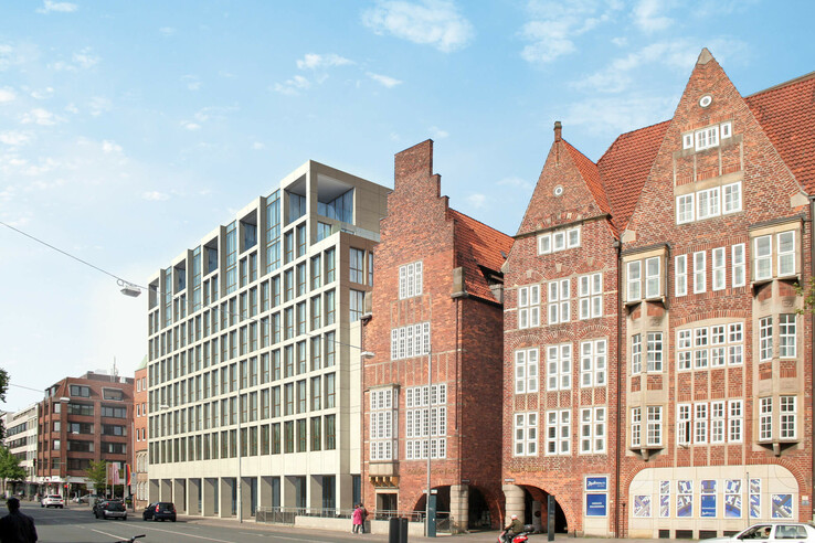 Modern and historic architecture of the ATLANTIC Grand Hotel Bremen under a blue sky.