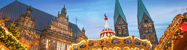 Bremen Christmas market with carousel and stylish lighting against a dark sky