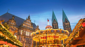 Bremen Christmas market with carousel and stylish lighting against a dark sky