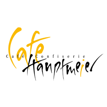 Logo von Café Hauptmeier mit stilisierten gelben und schwarzen Schriftzügen auf weißem Hintergrund.