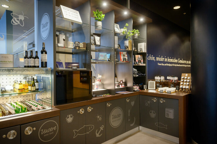 Hotel store with shelves full of souvenirs, drinks and plants at the ATLANTIC Hotel Sail City Bremerhaven.