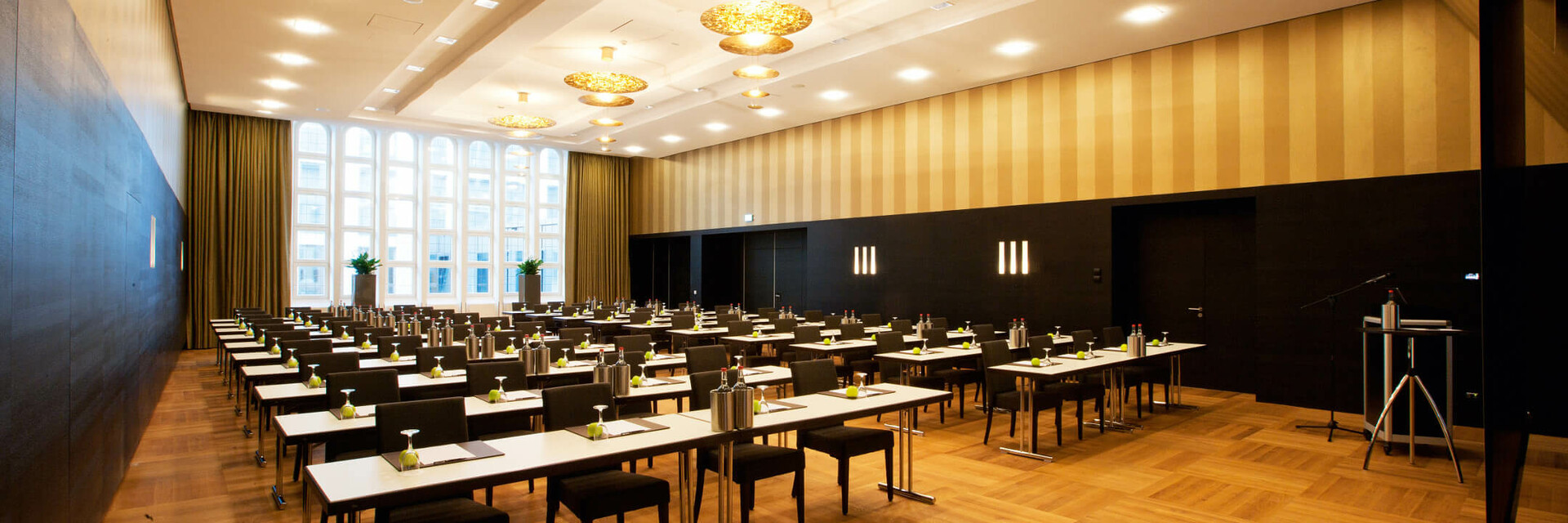 Modern conference room in the ATLANTIC Grand Hotel Bremen with elegant seating and large windows.