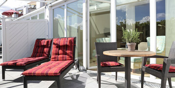 Junior Suites on the ground floor have a terrace with cosy seating corner
