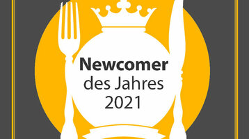 Auszeichnung "Newcomer des Jahres 2021" von "münster geht aus" auf grauem Hintergrund.