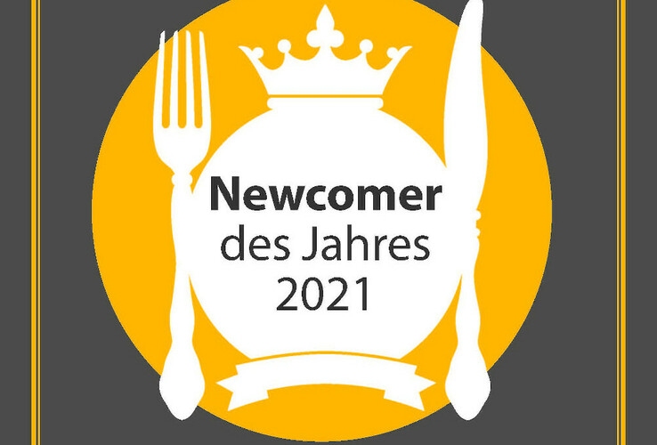 Auszeichnung "Newcomer des Jahres 2021" von "münster geht aus" auf grauem Hintergrund.