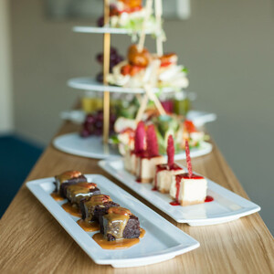 Coffee break at the ATLANTIC Hotel Airport Elegant dessert selection on white plates in a bright room of the ATLANTIC Hotel Airport Bremen.
