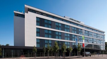 Modern hotel façade of the ATLANTIC Congress Hotel in Essen with lots of glass.