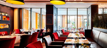 Tables laid in the alto restaurant at the ATLANTIC Grand Hotel Bremen