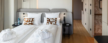 A comfortable double bed in the Skyline Suite.