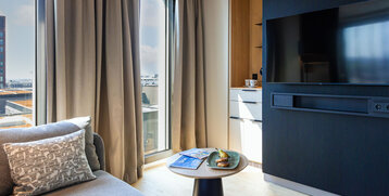 A cosy seating area with a view and a clear line of sight to the television.