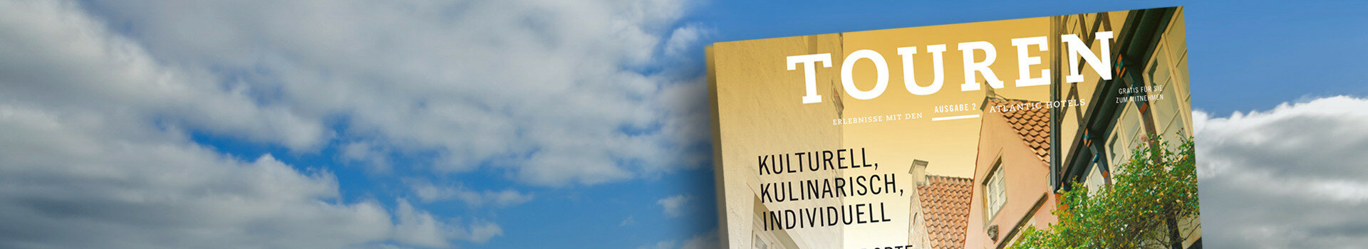 ATLANTIC Hotels Leisure-Magazine Cover of a magazine with the title "TOUREN" in front of a cloudy sky, showing buildings and trees.