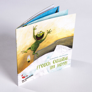 Kinderbuch "Frosch Oswald im Hotel" Ein Kinderbuch mit einem fröhlichen Frosch auf dem Cover, Titel: "Frosch Oswald im Hotel".