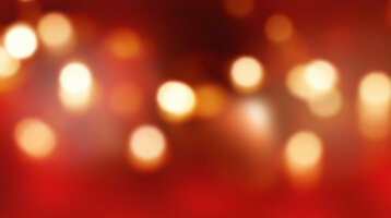 Holzboden vor unscharfem, rot-goldenem Bokeh-Hintergrund im ATLANTIC Grand Hotel Bremen.