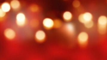 Wooden floor in front of a blurred, red-gold bokeh background in the ATLANTIC Grand Hotel Bremen.