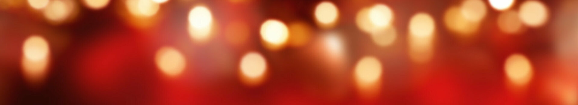 Wooden floor in front of a blurred, red-gold bokeh background in the ATLANTIC Grand Hotel Bremen.